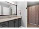 Bathroom boasts granite countertops, large mirror, and neutral tones at 174 St. Andrews Ln, Chapel Hill, NC 27517