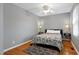 Cozy bedroom with hardwood floors and a comfortable queen size bed at 174 St. Andrews Ln, Chapel Hill, NC 27517