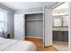 Bright bedroom with open closet and view into the ensuite bathroom at 174 St. Andrews Ln, Chapel Hill, NC 27517
