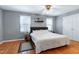 Spacious primary bedroom with hardwood floors and a ceiling fan at 174 St. Andrews Ln, Chapel Hill, NC 27517