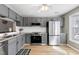 Updated kitchen boasting stainless steel appliances, granite counters, and ample cabinet space at 174 St. Andrews Ln, Chapel Hill, NC 27517