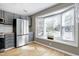 Bright kitchen featuring stainless appliances and a large bay window at 174 St. Andrews Ln, Chapel Hill, NC 27517