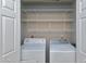 Convenient laundry closet equipped with a washer and dryer at 174 St. Andrews Ln, Chapel Hill, NC 27517