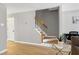 Inviting living room featuring hardwood floors and staircase leading to the upper level at 174 St. Andrews Ln, Chapel Hill, NC 27517