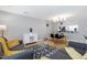 Inviting living area featuring hardwood floors, comfortable seating, and an open dining space at 174 St. Andrews Ln, Chapel Hill, NC 27517
