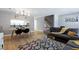 Open-concept living and dining area with a modern table setting and comfortable seating at 174 St. Andrews Ln, Chapel Hill, NC 27517