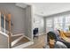 Cozy living space with hardwood floors, a desk area, and bright windows overlooking the yard at 174 St. Andrews Ln, Chapel Hill, NC 27517