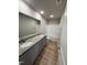 Clean bathroom with a double sink vanity, granite countertop, and shower-tub combo at 197 Pate Landing Dr, Selma, NC 27576