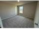 Bedroom with a window bringing in natural light and plush carpet at 197 Pate Landing Dr, Selma, NC 27576