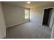 Bedroom with a window and plush carpet at 197 Pate Landing Dr, Selma, NC 27576