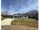 Charming single-story home with a well-manicured lawn, concrete driveway, and inviting front porch at 197 Pate Landing Dr, Selma, NC 27576