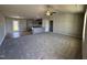 Spacious living room with open layout flowing into kitchen, featuring modern flooring and neutral color scheme at 197 Pate Landing Dr, Selma, NC 27576