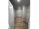 Spacious walk-in closet with wood-look flooring, wire shelving and neutral paint at 197 Pate Landing Dr, Selma, NC 27576