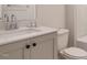 Bathroom featuring a sleek vanity with modern fixtures, ample countertop space, and a toilet at 205 Big Bradley Dr, Wendell, NC 27591