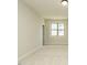 Bright bedroom with a neutral color palette, plush carpet, and a large window providing natural light at 205 Big Bradley Dr, Wendell, NC 27591