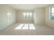 Spacious bedroom features a carpet floor, multiple windows, and ample closet space at 205 Big Bradley Dr, Wendell, NC 27591