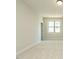 Bright bedroom with plush carpet, a large window, and neutral paint colors at 205 Big Bradley Dr, Wendell, NC 27591