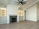 A living room with fireplace, built-in cabinets and a view into other rooms at 205 Big Bradley Dr, Wendell, NC 27591