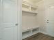 Well-organized mudroom with built-in storage, bench seating, and convenient access to outdoors at 205 Big Bradley Dr, Wendell, NC 27591