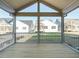 Inviting back porch with wood decking, offering scenic views of the backyard at 205 Big Bradley Dr, Wendell, NC 27591