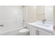 Bright bathroom featuring a vanity with a white countertop and shower and tub combo at 211 Whitney Ln, Durham, NC 27713
