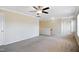 Large bonus room with neutral walls and ceiling fan, perfect for entertainment and relaxation at 211 Whitney Ln, Durham, NC 27713