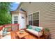 Stylish outdoor deck with comfortable seating and scenic backyard view at 211 Whitney Ln, Durham, NC 27713