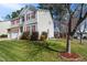 Beautifully landscaped yard with flowering shrubs enhances this two-story home at 211 Whitney Ln, Durham, NC 27713