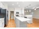Modern kitchen featuring an island with white countertops and stainless steel appliances at 211 Whitney Ln, Durham, NC 27713