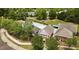 Overhead view of a community pool, including a pool house, lounge chairs, and an Auburn Swim Club sign at 211 Whitney Ln, Durham, NC 27713