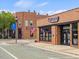 Charming brick commercial building, with US flags flying, street access and nice curb appeal at 233 Breezemont Dr, Fuquay Varina, NC 27526