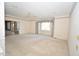 Bedroom featuring carpet, a ceiling fan, and a large picture window with floral curtains at 30 Brookside Place, Durham, NC 27705