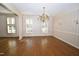 Dining room with hardwood floors, classic chandelier, and ample natural light at 30 Brookside Place, Durham, NC 27705
