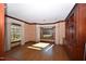 Bright living room featuring hardwood floors, natural light, bay windows and traditional wood trim at 30 Brookside Place, Durham, NC 27705