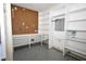 Organized storage room with built-in shelving and a pegboard for tools at 30 Brookside Place, Durham, NC 27705
