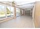Bright sunroom with tile floors, ceiling fans, skylights, and multiple glass windows to enjoy scenic views at 30 Brookside Place, Durham, NC 27705