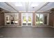 Inviting sunroom featuring a tile floor and a wall of sliding glass doors for outdoor views at 30 Brookside Place, Durham, NC 27705