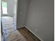 Bright entryway featuring light walls, a door, and flooring covered in protective material at 332 Chesapeak Commons St # 141, Garner, NC 27529