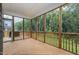 Screened porch with wood floors, railing, and ceiling at 401 Shadow Falls Dr, Wendell, NC 27591