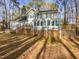 Charming two-story home with a spacious backyard and a wooden deck for outdoor entertaining at 4016 Ridgebrook Bluffs Dr, Raleigh, NC 27603