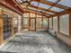 Sunroom featuring wood framed windows, brick flooring, and a ceiling fan at 4016 Ridgebrook Bluffs Dr, Raleigh, NC 27603