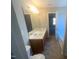 Bathroom showcasing double sinks, a large mirror, and a tub at 405 Ganyard Farm Way, Durham, NC 27703