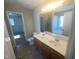 Bathroom features double sinks, a large mirror, and a separate tub and shower at 405 Ganyard Farm Way, Durham, NC 27703