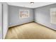 Bright bedroom featuring neutral walls, carpeted floor, and a window that provides natural light at 405 Ganyard Farm Way, Durham, NC 27703