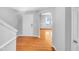 Foyer view with hardwood floors and arched doorway leading to another room at 405 Ganyard Farm Way, Durham, NC 27703