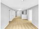 Upstairs hallway showcasing multiple doorways and neutral carpet, connecting different areas of the home at 405 Ganyard Farm Way, Durham, NC 27703