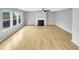Spacious living room showcasing a fireplace and large windows that fill the area with natural light at 405 Ganyard Farm Way, Durham, NC 27703
