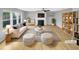 Bright, staged living room featuring a fireplace, modern furnishings, and plenty of natural light at 405 Ganyard Farm Way, Durham, NC 27703