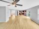Open-concept layout featuring light floors and connecting the living area to the modern kitchen at 405 Ganyard Farm Way, Durham, NC 27703
