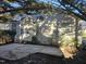 A quaint backyard featuring a concrete patio and a charming entrance with white stairs at 4300 Mantua Way, Raleigh, NC 27604